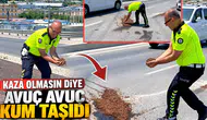 Kaza olmasın diye avuç avuç kum taşıdı