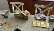 Yolsuzluk soruşturmasında yüklü miktarda döviz ve altın ele geçirildi