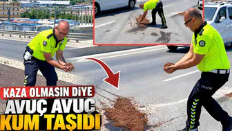 Kaza olmasın diye avuç avuç kum taşıdı