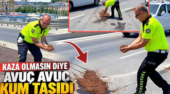 Kaza olmasın diye avuç avuç kum taşıdı
