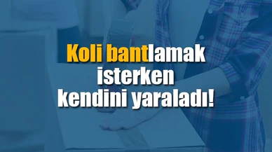 Koli bantlamak isterken kendini yaraladı