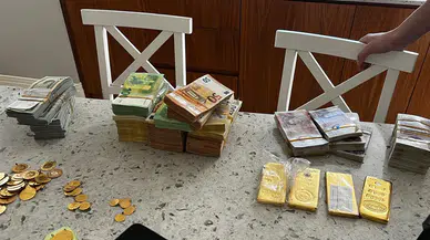 Yolsuzluk soruşturmasında yüklü miktarda döviz ve altın ele geçirildi